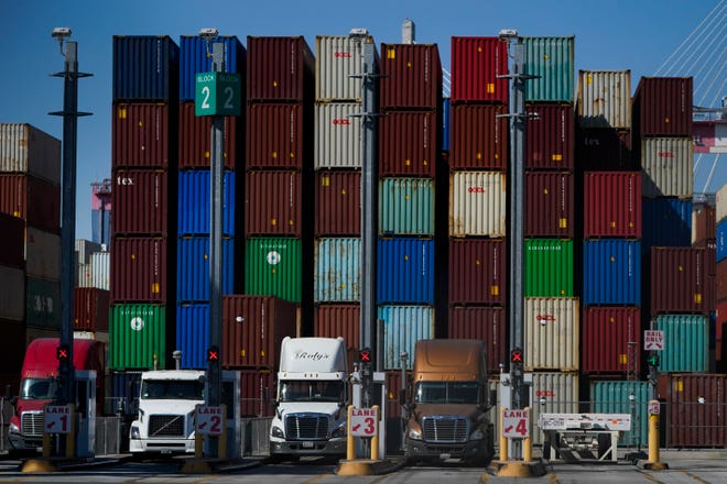 Containers are stacked at the Port of Long Beach in Long Beach in Calif., Friday, Oct. 1, 2021. While congestion at the state's ports have slowed deliveries of imports, it's also made it harder for the state's farmers to export crops to markets in Asia.