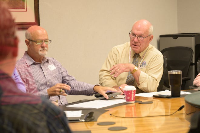 Alan Hays, right, sits with Walter Price during the recount for a close Tavares City Council race on Friday, Nov. 8, 2019. Walter Price, left, ultimately lost the election by five votes.