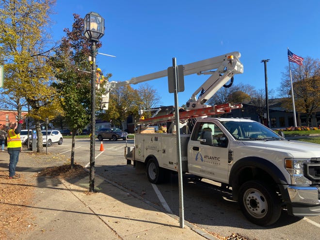 Atlantic Broadband donated time Friday, Nov. 5 to assist the Dover chamber in hanging holiday lights downtown.