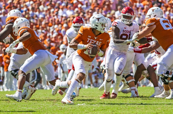 Texas quarterback Casey Thompson looks for an open receiver during a game against the Oklahoma Sooners in October. Both the Longhorns and Sooners have decided to join the SEC, which has delayed any change in the College Football Playoff format.