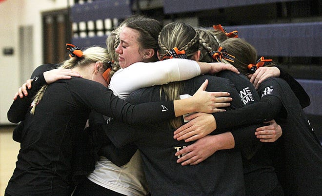 The Sturgis volleyball team shares one final hug as a team following a loss in the district finals on Thursday.