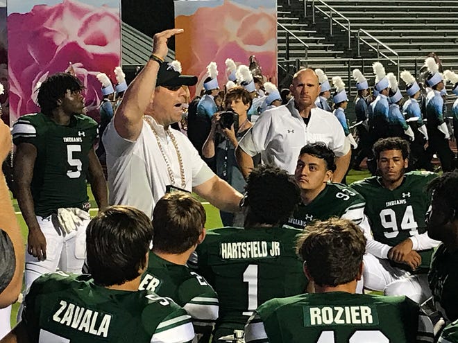 Waxahachie head football coach Shane Tolleson addresses his team after a 43-25 victory over Mansfield at Lumpkins Stadium on Oct. 22.