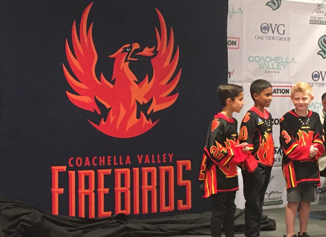 Members of the Desert Blaze youth hockey team help reveal the name and logo of the desert's American Hockey League team: The Coachella Valley Firebirds