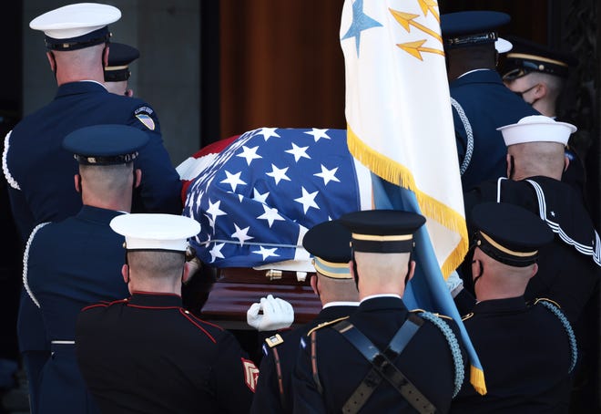 The casket of former Secretary of State Colin Powell is transported for his funeral service to the Washington National Cathedral on November 5, 2021 in Washington, DC.  Powell, who died on October 18, 2021 of complications from Covid-19, served three presidents during his military and diplomatic career.