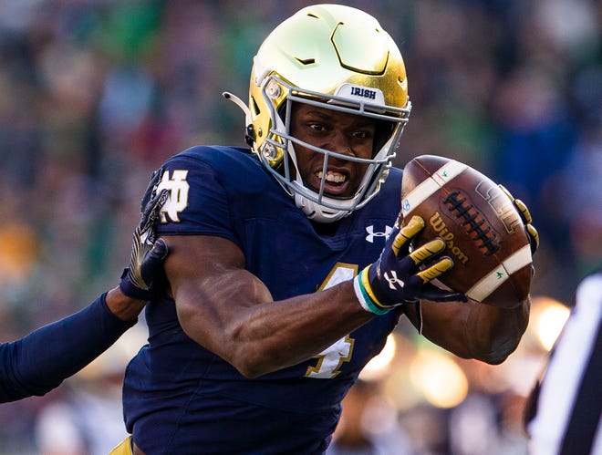 Notre Dame’s Kevin Austin Jr. (4) makes a catch during the Notre Dame vs. Navy NCAA football game Saturday, Nov. 6, 2021 at Notre Dame Stadium in South Bend.