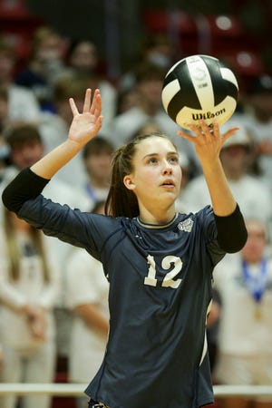 Central Catholic's Kaitlyn Kuckkan (12) serves during the first set of the IHSAA Class A volleyball state finals, Saturday, Nov. 6, 2021 at Ball State University's Worthen Arena in Muncie.