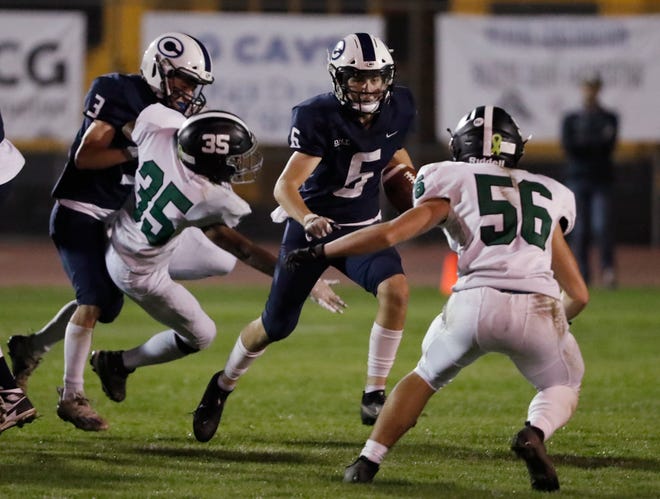 Central Valley Christian's Chapman Dunn looks for room to run against El Diamante during their Central Section Division III high school football game in Visalia, Calif., Friday, Nov. 5, 2021.