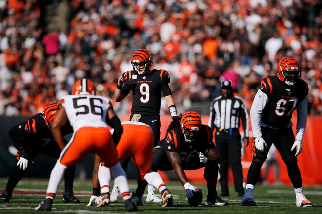 Cincinnati Bengals quarterback Joe Burrow (9) sets up a play at the line in the first quarter of the NFL Week 9 game between the Cincinnati Bengals and the Cleveland Browns at Paul Brown Stadium in Cincinnati on Sunday, Nov. 7, 2021. Cleveland led 24-10 at halftime. 