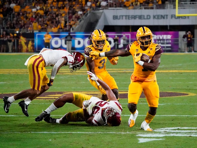 Nov 6, 2021; Tempe, Arizona, USA; Arizona State Sun Devils running back DeaMonte Trayanum (1) sheds the tackle by USC Trojans linebacker Kana'i Mauga (26) then runs for a touchdown in the first half at Sun Devil Stadium.