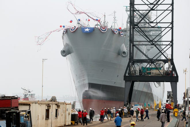 The U.S. Navy launches the USNS Harvey Milk, a fleet replenishment oiler ship named after the first openly gay elected official, in San Diego Saturday.