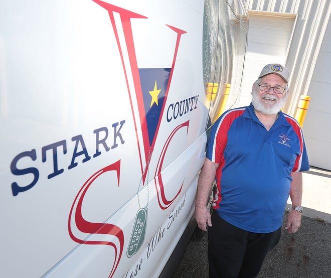 Joseph Decker Jr. is the Stark County Veteran of the Year. He is pictured with the van he drives for the Veterans Service Commission.