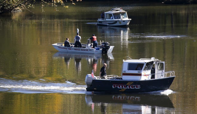 Tuscaloosa Fire Rescue Service divers and Tuscaloosa Police search the Black Warrior River on the Tuscaloosa waterfront Monday, Nov. 8, 2021, after a man was reported missing two days ago. University of Alabama student Garrett Winston James Walker, 20, was reported missing Sunday afternoon by his parents after his mobile phone was located near the Tuscaloosa Riverwalk. [Staff Photo/Gary Cosby Jr.]