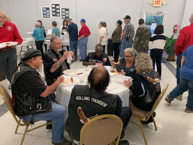 Sharing is a big part of the veterans' breakfast.