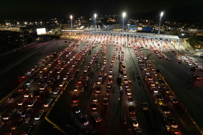 Vehicles line up to cross the border at the San Ysidro port on the U.S.-Mexican border in Tijuana, Baja California state, Mexico, as the U.S border reopens for nonessential travel on Nov. 8.