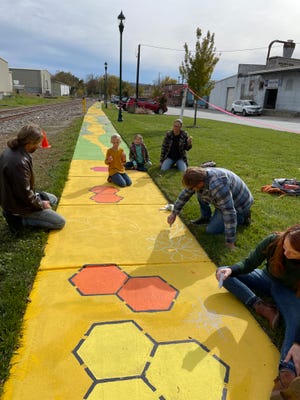 Work continues on the Fifth Avenue and Maple Street sidewalk mural project, which will connect the Main Street and Seventh Avenue business districts. Residents can sign up for 30-minute slots to fill in colors this Friday, Nov. 12.