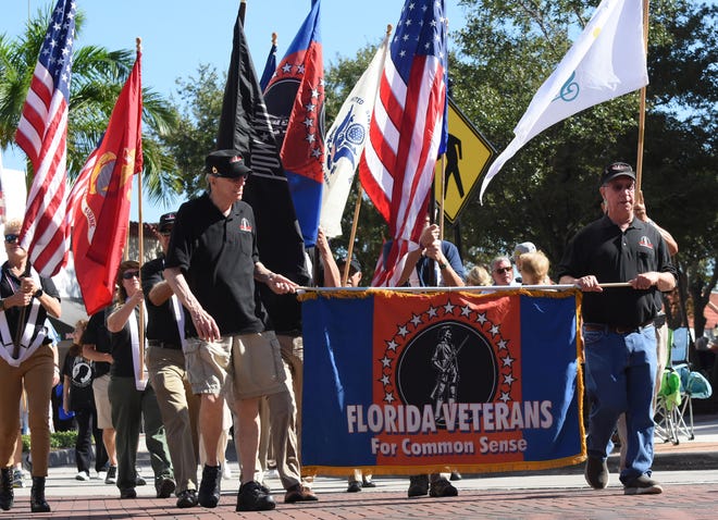 Florida Veterans for Common Sense walk in the 2019 Veterans Day Parade on Main Street in Sarasota. This year, the parade is officially back, after a hiatus in 2020, when an official parade was not held, though a ceremony was still conducted at Chaplain J.D. Hamel Park.