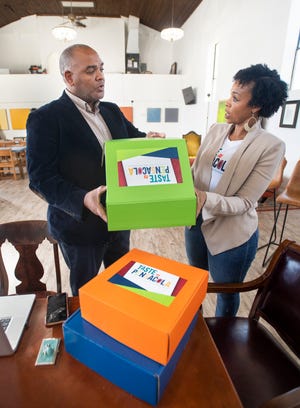 Mentor Brian Wyer, President & CEO of the Gulf Coast Minority Chamber of Commerce, left, and entrepreneur Tia Robbins, owner of Taste of Pensacola, talk as they participate in the new "Startups on the Blocks" program at The Kukua Institute in Pensacola on Monday, Nov. 8, 2021.