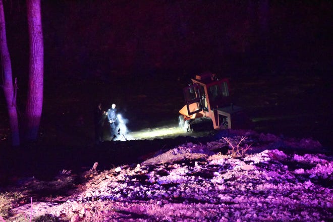 A street sweeper sits in the Whitewater River after it was stolen and driven through Richmond during an hourlong police pursuit Sunday, Nov. 7, 2021.