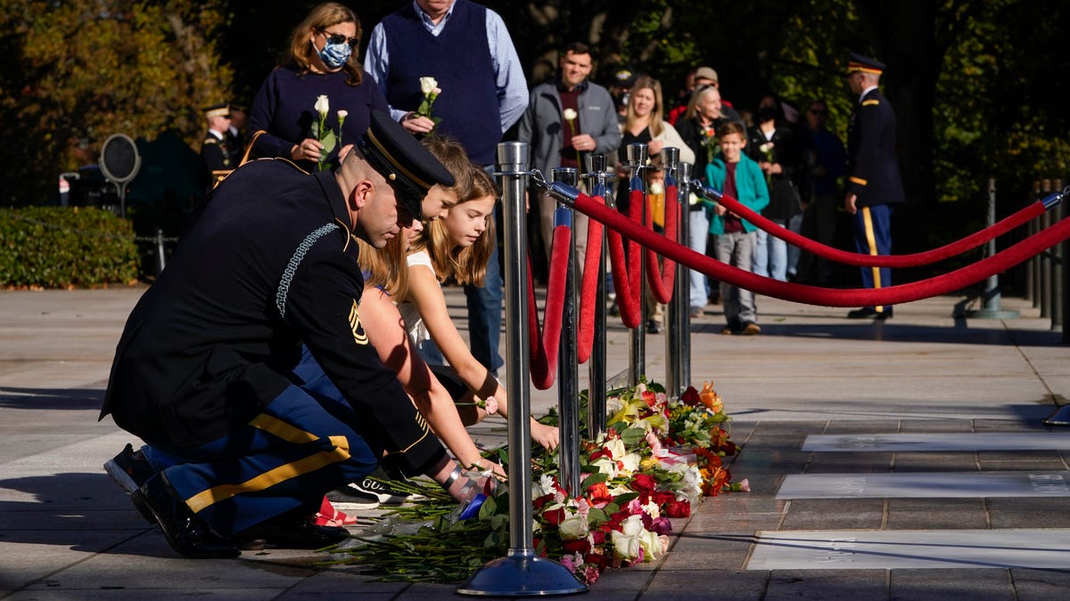 Nov. 9, 2021; Arlington, VA, USA. Members of the public lay flowers in front of the Tomb Of The Unknown Soldier at Arlington National Cemetery in Arlington, VA, on November 9, 2021. For the first time in nearly 100 years, and as part of the Tomb of the Unknown Soldier Centennial Commemoration, the public will be able to walk on the Tomb of the Unknown Soldier Plaza and lay flowers in front of the Unknown Soldier on Nov. 9 and 10, 2021. Photo by Jack   Gruber, USA TODAY.