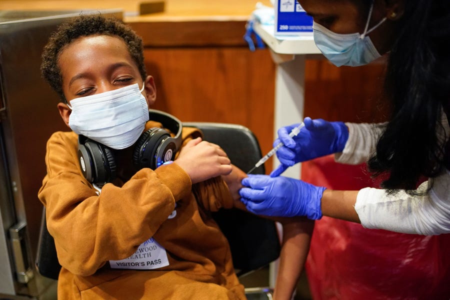 Cameron West, 9, receives a COVID-19 vaccination at Englewood Health in New Jersey. Health officials hailed shots for kids ages 5 to 11 as a major breakthrough after more than 18 months of illness, hospitalizations, deaths and disrupted education.