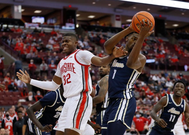 Akron Spips guard KJ Walton (1) grabs a rebound from Ohio State Buckeyes striker EJ Liddell (32) 67 in the second half of the NCAA men's basketball game at Value City Arena in Columbus on Tuesday, November 9, 2021 -66.