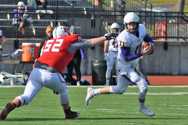 Knox College quarterback Kaile Williams rolls out of the pocket in a game against Monmouth College on Saturday, Nov. 9, 2019 at April Zorn Memorial Stadium in Monmouth.