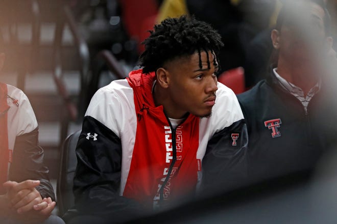 Texas Tech's Terrence Shannon, Jr. (1) sits on the bench during the first half of an NCAA college basketball game against North Florida, Tuesday, Nov. 9, 2021, in Lubbock, Texas.