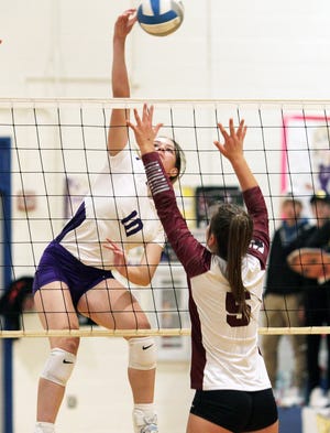 Aubree Calloway of Bronson hammers home a kill against Watervliet in the regional semifinals on Tuesday.