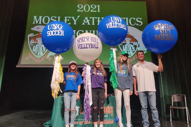 Mosley High School athletes, from left, Lexi Clark, Haile Hallmon, Liberty McLean, and Tyler Wave signed their college letters-of-intent on Wednesday afternoon.