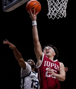 IUPUI Jaguars guard Boston Stanton III (25) reaches for a lay-up against Butler Bulldogs guard Jayden Taylor (13) on Tuesday, Nov. 9, 2021 at Hinkle Fieldhouse, in Indianapolis. The Butler Bulldogs defeated the IUPUI Jaguars, 56-47. 