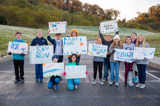 Students cheer on runners at the annual Ram Run held at Grace Christian Academy Saturday, Nov. 6, 2021.