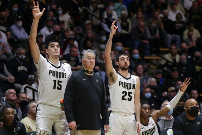 Purdue head coach Matt Painter watches a three point shot from the bench with Purdue center Zach Edey (15) and Purdue guard Ethan Morton (25) during the second half of an NCAA men's basketball game, Tuesday, Nov. 9, 2021 at Mackey Arena in West Lafayette.