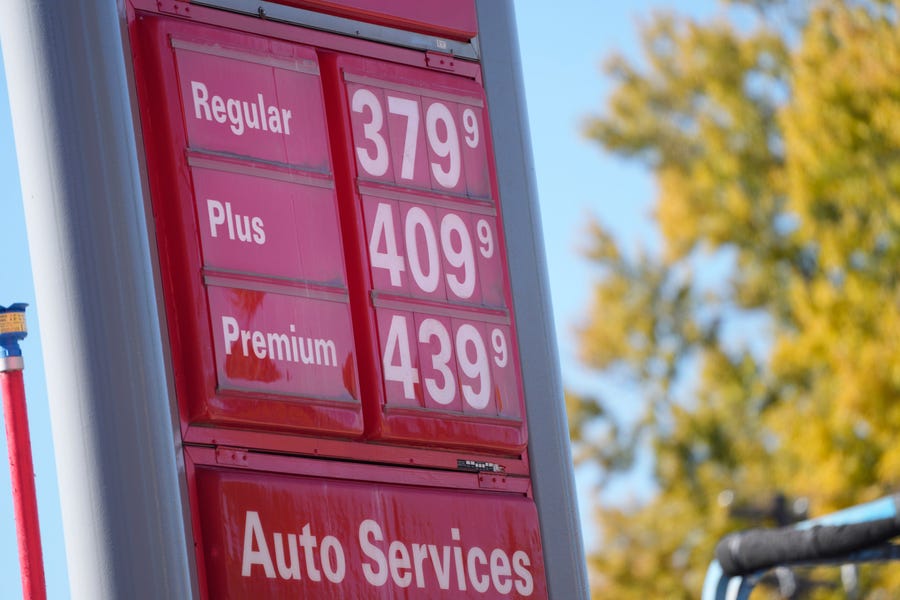 The price for grades of gasoline are listed outside a Conoco station Nov. 5 in Denver.