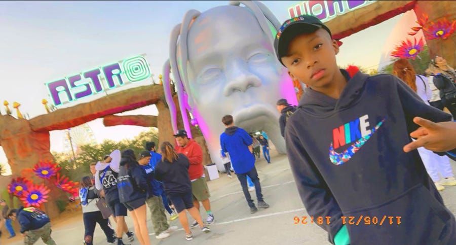 This photo provided by Taylor Blount shows Ezra Blount, 9, posing outside the Astroworld music festival in Houston. Ezra was injured at the concert during a crowd surge.