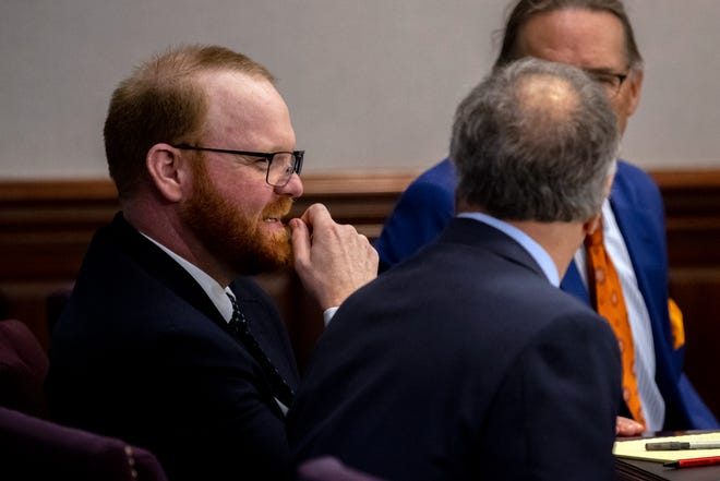 Travis McMichael, left, listens to his attorney Robert Rubin during a recess in his trial in the Glynn County Courthouse, Tuesday, Nov. 9, 2021, in Brunswick, Ga. Travis McMichael along with his father Greg McMichael and a neighbor, William "Roddie" Bryan are charged with the February 2020 slaying of 25-year-old Ahmaud Arbery.