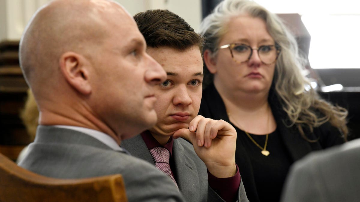 Kyle Rittenhouse, center, and his lawyers Corey Chirafisi and Natalie Wisco look on after a break in proceedings in his trial at the Kenosha County Courthouse in Kenosha, Wis., on Tuesday, Nov. 9, 2021. Rittenhouse is accused of killing two people and wounding a third during a protest over police brutality in Kenosha, last year. (Mark Hertzberg/Pool Photo via AP) ORG XMIT: WIPO303