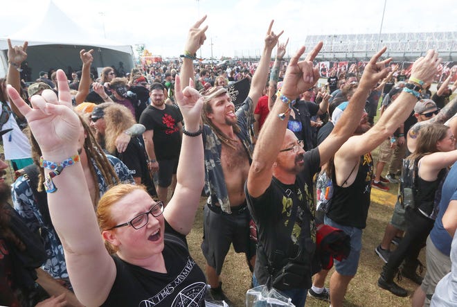 Rockers cheer the performance of the band Shadow the Earth, Thursday November 11, 2021 as Welcome to Rockville kicks off at Daytona International Speedway.
