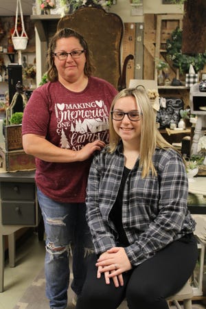 Carleton resident Elizabeth McNett (left) with her daughter, Sydney. McNett and her aunt, Missy White, both Carleton residents, own and operate Once and Again Home Boutique, 11984 Telegraph Rd. Their business specializes in unique handcrafted decor and refurbished furniture.  Provided by KENNEDY BOWLING
