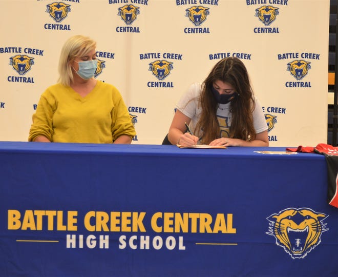 Battle Creek Central's Sierra Baldwin, along with her mother Christina Baldwin, signs her national letter of intent to play college softball at North Carolina A&T on Wednesday at BCC High School. While Baldwin is a college softball prospect, she plans to play high school baseball this spring with the Bearcats.
