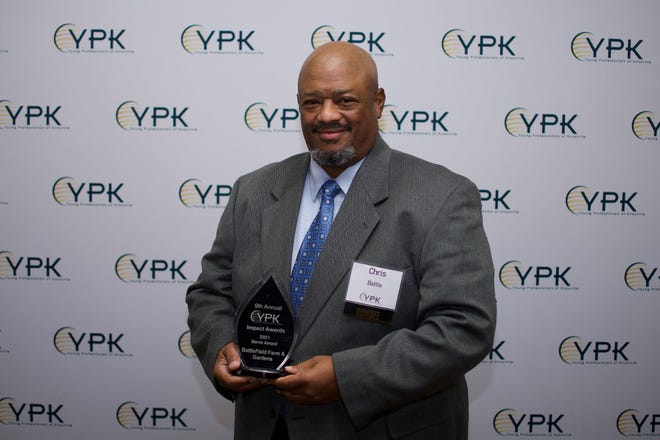 The Rev. Chris Battle with his 2021 “Serve” Impact Award from Young Professionals of Knoxville. Nov. 5, 2021