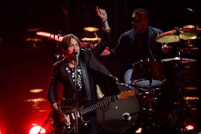 Keith Urban performs during the CMA Awards at Bridgestone Arena in Nashville, Tennessee, on Nov. 10, 2021.