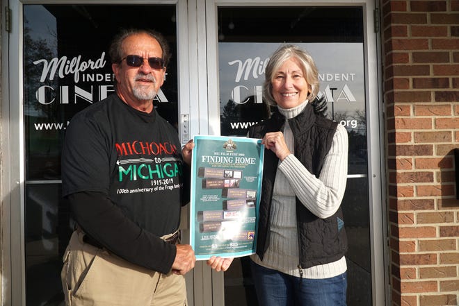 Len Radjewski and Sherri Masson hold a flyer for the upcoming Milford Independent Cinema Film Fest.  Radjewski's "Michoacan to Michigan" film will be shown during the festival that begins on Nov. 21.