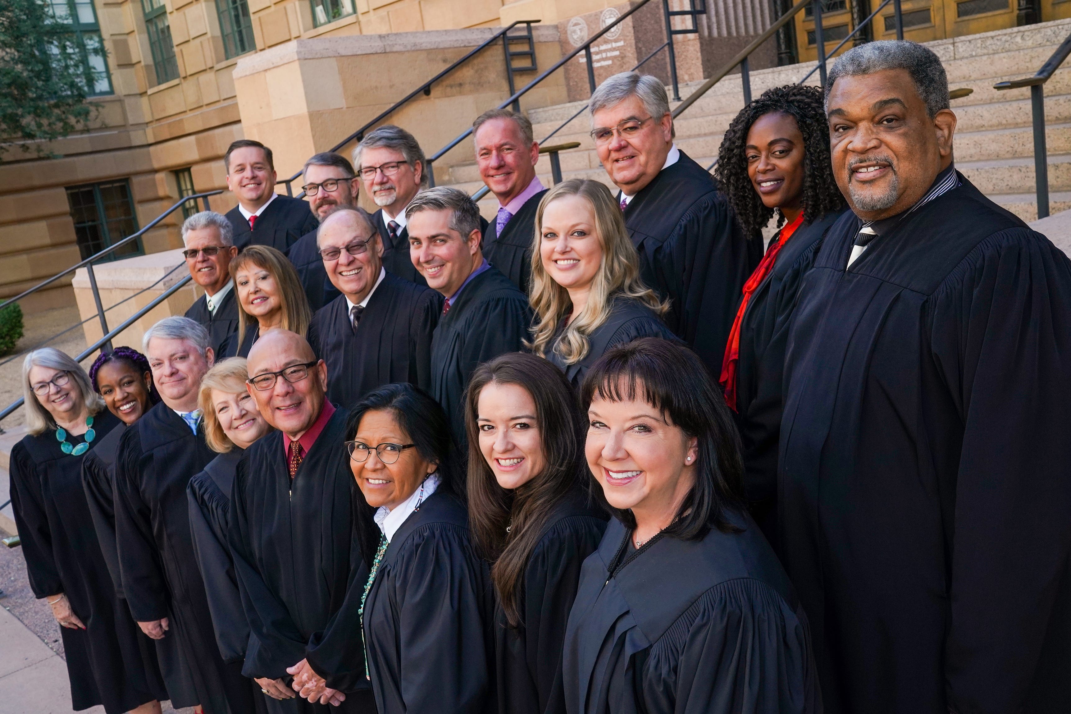 Justices of the peace in Maricopa County pose for a group photo outside the Maricopa County Courthouse on Friday, Oct. 29, 2021, in Phoenix.