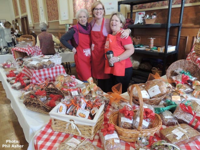 St. John's red apron gang is ready with breads, muffins and rolls galore for the annual Christmas Market.