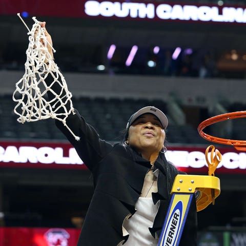 Dawn Staley celebrates with the net after South Ca