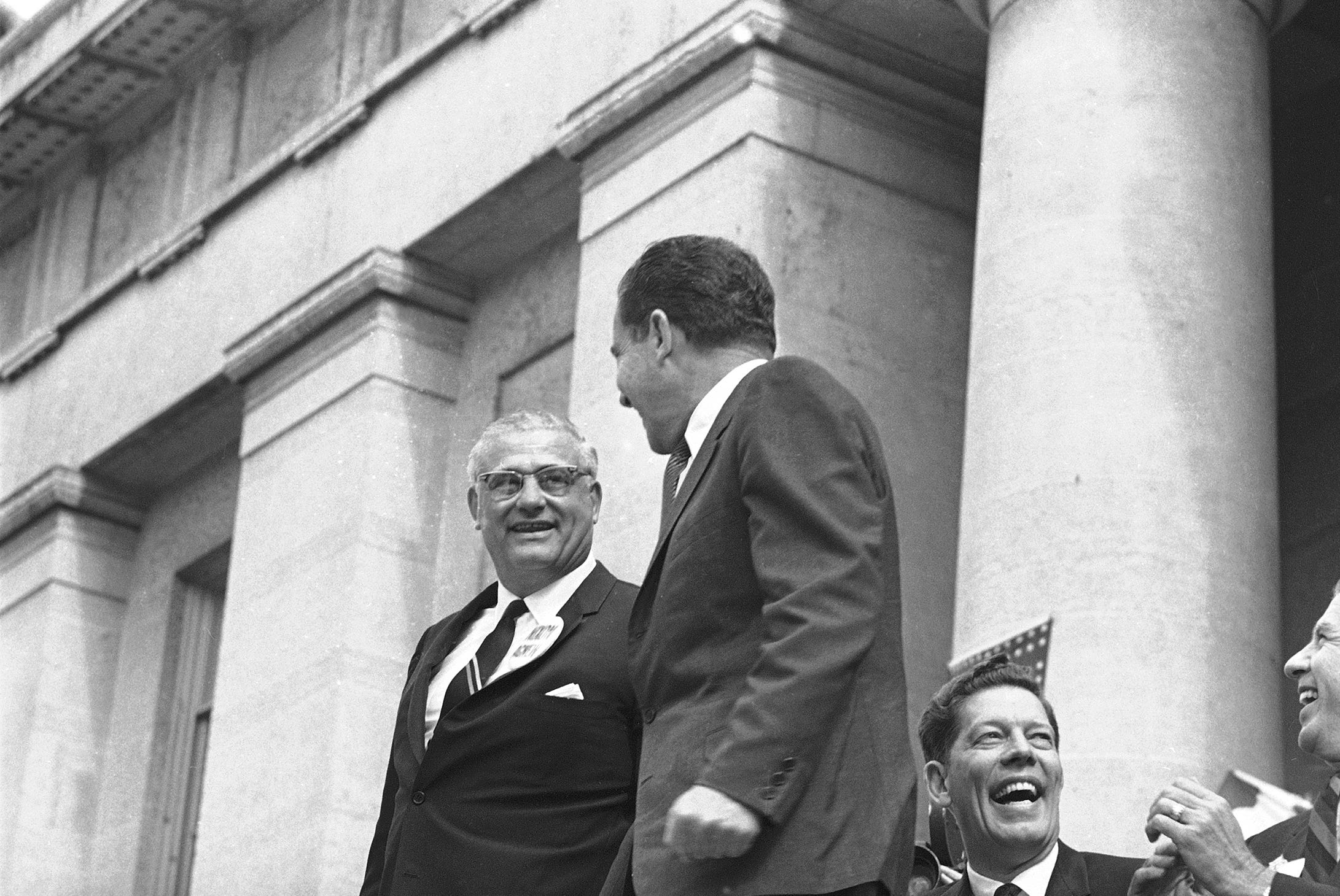 Republican presidential nominee Richard Nixon, right, has a quick chat in Columbus, Ohio, October 22, 1968, with Ohio State University football coach Woody Hayes, as both continue their campaigns to become No. 1. Nixon in politics and Hayes in the football ratings. Nixon spoke from the steps of the Ohio Capitol and Hayes was on the speaker's stand. (AP Photo)