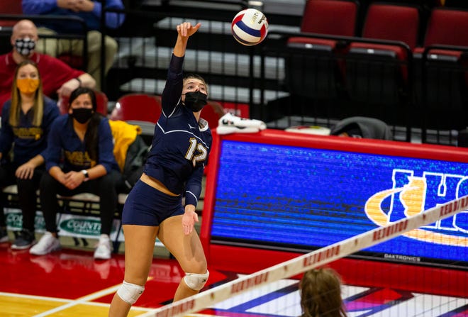 Freeport Aquin's Lucy Arndt (12) loads up on a kill against Champaign St. Thomas More during the semifinals of the IHSA Class 1A State Final Tournament at Redbird Arena in Normal, Ill., Friday, November 12, 2021. [Justin L. Fowler/The State Journal-Register] 