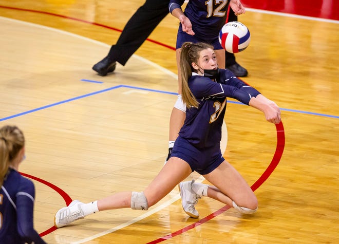 Aquin's Ava Hiveley, shown returning a serve during the Class 1A state semifinals, was one of two Bulldogs named first-team all-NUIC North in girls volleyball. Two other Aquin players were named to the second team and a fifth was honorable mention.