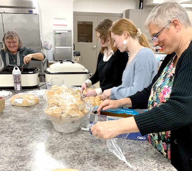 Volunteers Barbara Kwiatkowski, Sydney Kaiser, Autumn Major and Kathy Lawrence helped to prepare food for a Veterans Day honor banquet Thursday at Firm Foundation Ministries in Centreville.