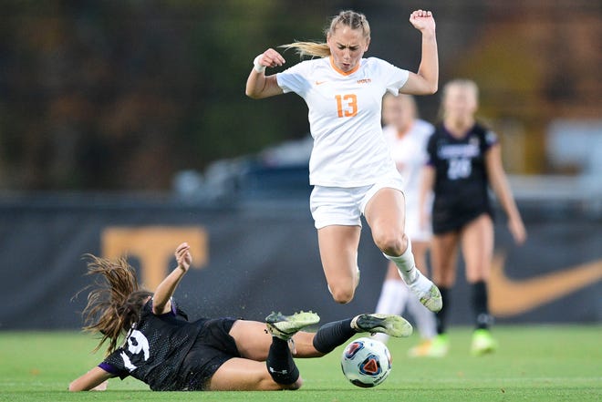 Tennessee midfielder/forward Taylor Huff (13) leaps over Lipscomb defender Alivia Carapazza (19) during a first round NCAA Division I Tournament soccer game between Tennessee and Lipscomb at Regal Soccer Stadium in Knoxville, Tenn. on Friday, Nov. 12, 2021.